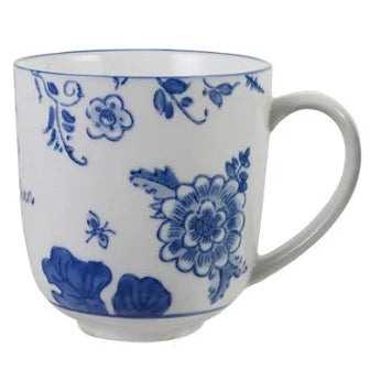 A white ceramic coffee mug with a classic blue floral and leaf pattern, featuring a curved handle and a small saucer base, set against a plain white background.